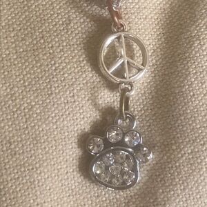 Elegant Silver Peace and Paw Necklace